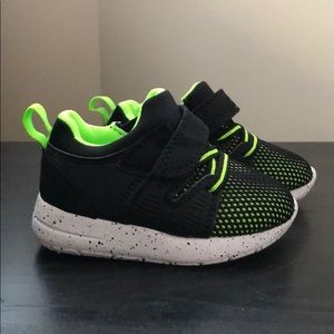 Green and black sneakers